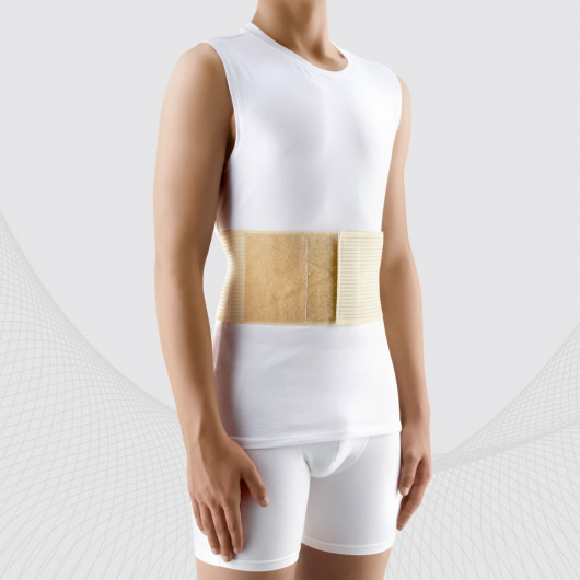 Medisinsk elastisk belte for behandling med umbilisk bronløshet mot umbilisk hernia, med et flyttbart og flyttbart plagg